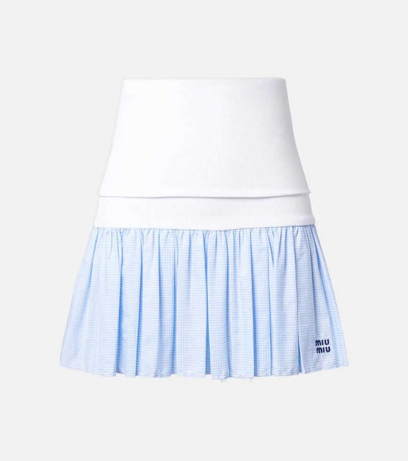 Miu Miu Gingham jersey and poplin miniskirt — flat-lay front view showing white ribbed waistband and blue gingham pleated skirt